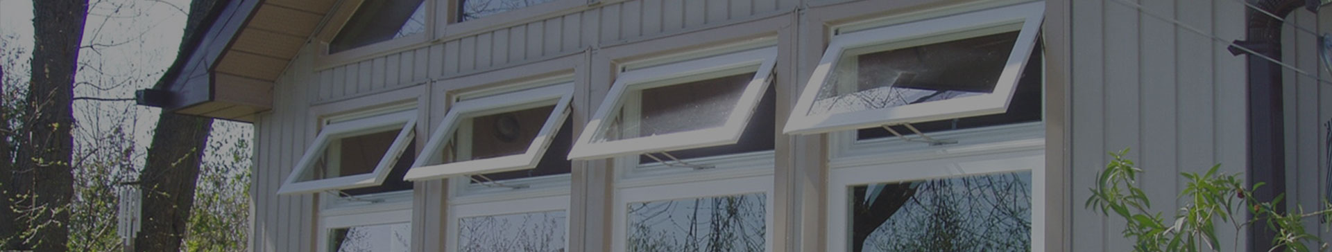 Top-hinged awning windows on a building exterior